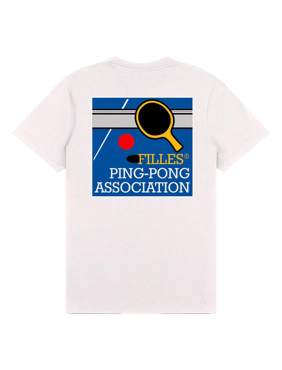A white short-sleeve t-shirt shown flat against a white background, featuring a blue, yellow, and red graphic on the chest that reads 'FILLES PING-PONG ASSOCIATION' with a ping-pong paddle and ball illustration.